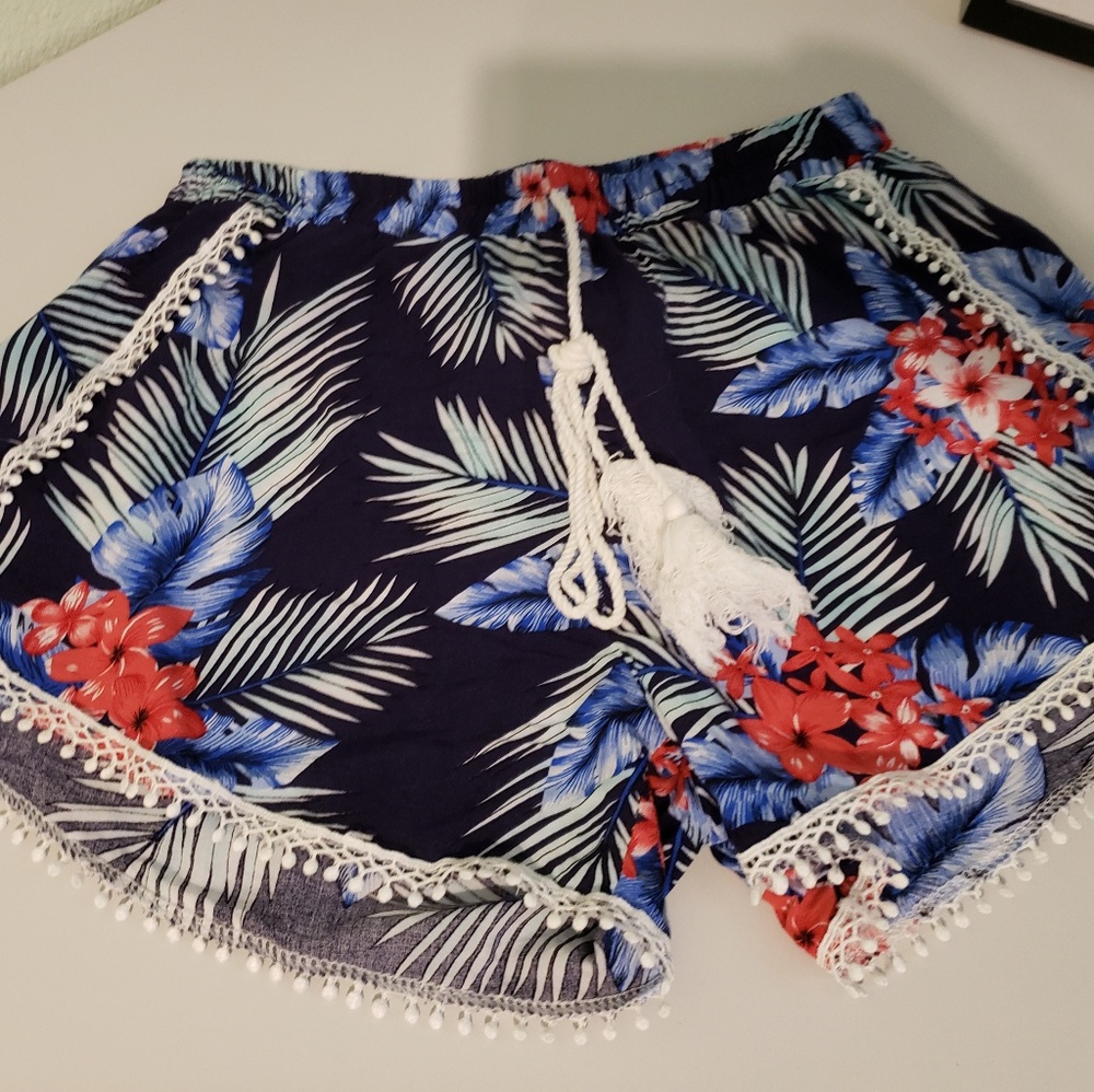 Cute, tropical navy blue shorts with pom-poms